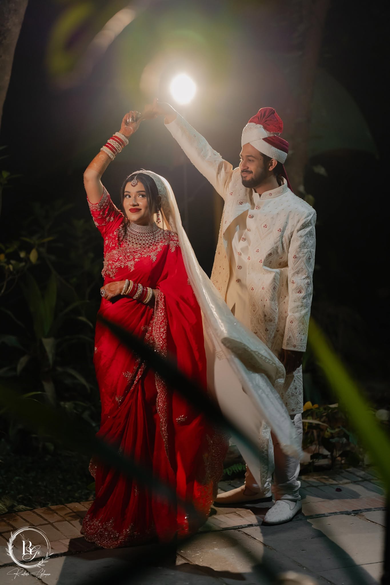 Couple dancing under dramatic light