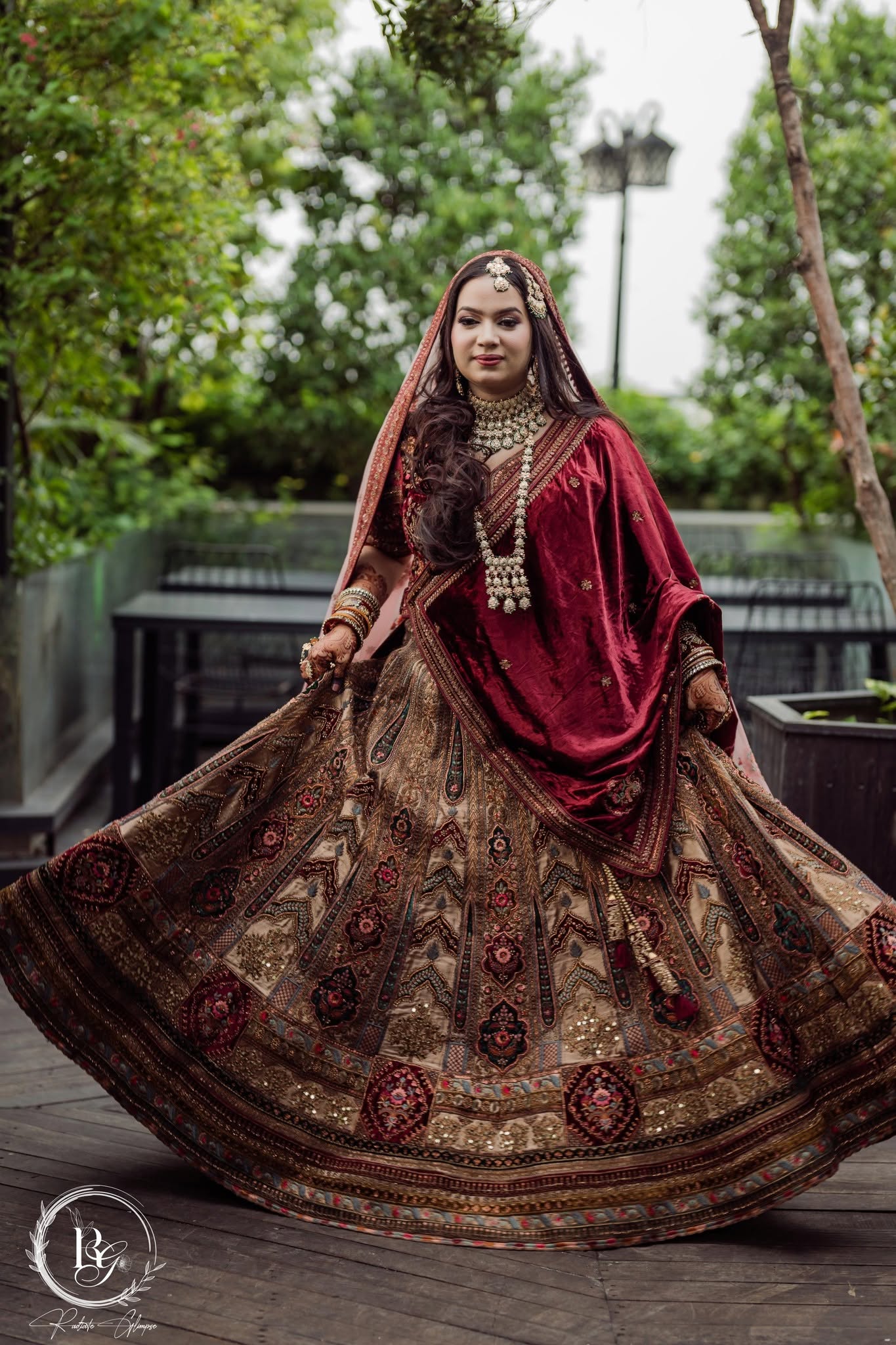 Bride twirling in embroidered lehenga