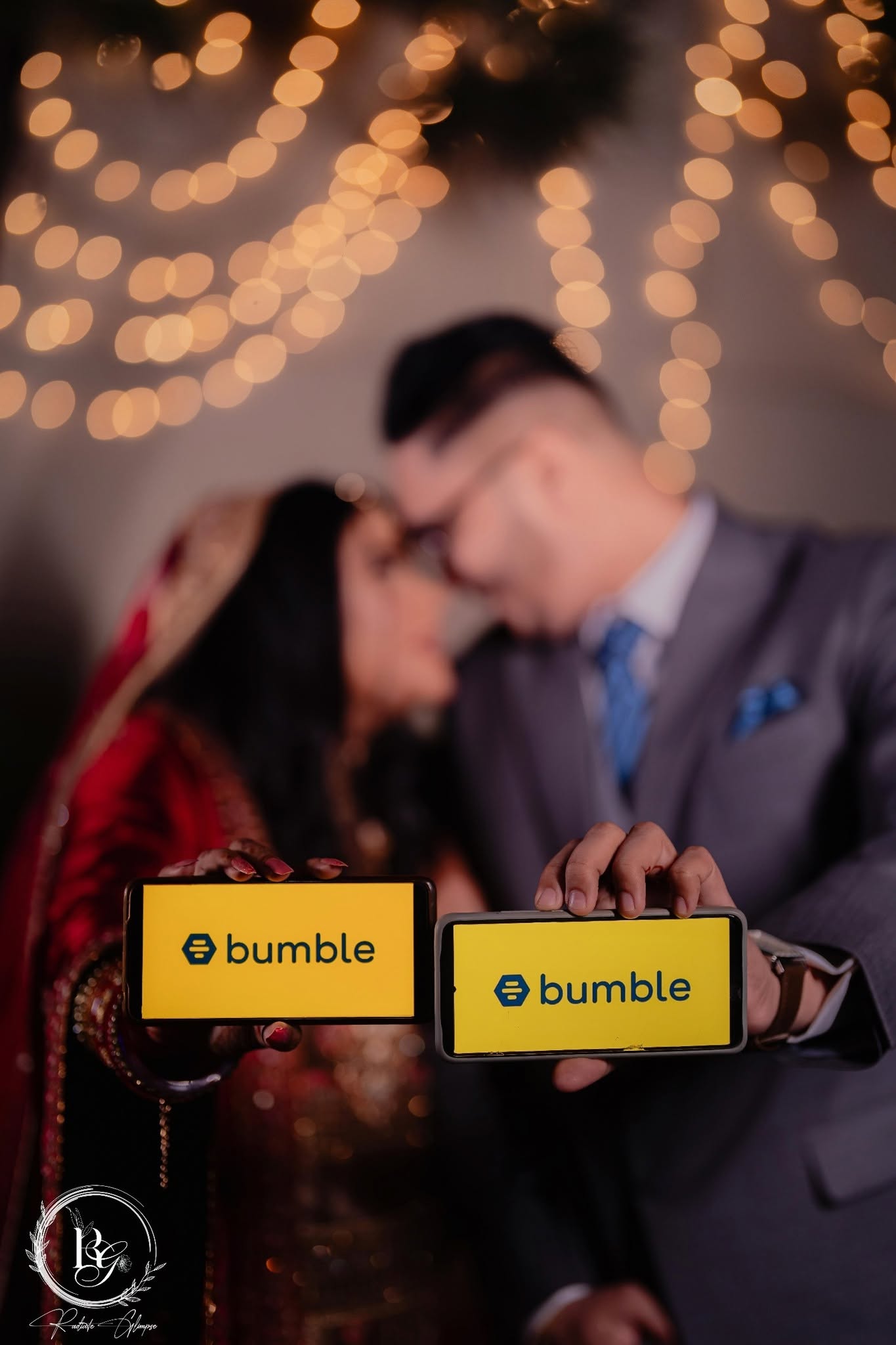 Couple holding Bumble phones at reception