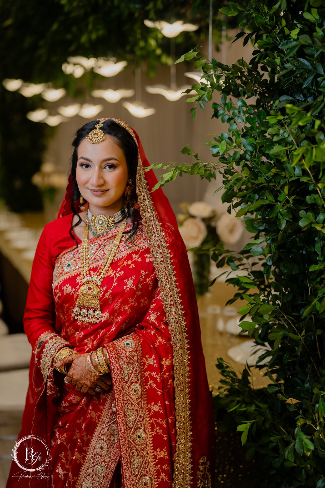Bride in red saree with gold jewellery